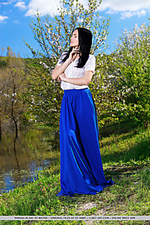 Indiana blanc strips her long skirt and white blouse baring her slender body with small tits and pink pussy as she poses in the outdoors.