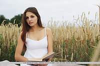 Alise moreno out in the open, grassy field, alise moreno enjoys reading a book before deciding to get naked