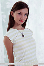 Iva iva strips on the bed as she bares her sweet, unshave pussy.