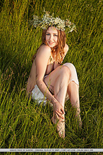 Ginger frost ginger frost delightfully poses on the grassy field baring he unshaven pussy.