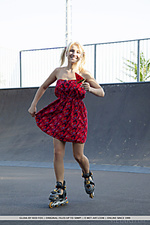 Gloia newcomer gloia bares her shaved pussy as she rides her in-line skates.