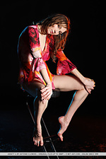 Annett a annett a sensaully poses on the chair baring her sexy, tight body.