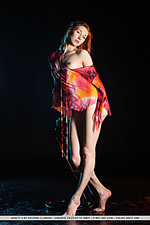 Annett a annett a sensaully poses on the chair baring her sexy, tight body.