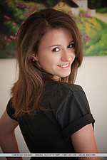 Cameran new model cameran playfully strips on the bed baring her nubile body.