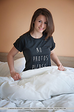 Cameran new model cameran playfully strips on the bed baring her nubile body.