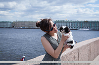 Ulia ulia sensually poses on the bed as she displays her unshaven pussy.