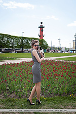 Ulia ulia sensually poses on the bed as she displays her unshaven pussy.