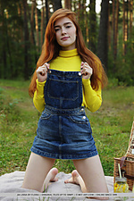 Jia lissa redhead jia lissa strips outdoors as she displays her trimmed pussy.