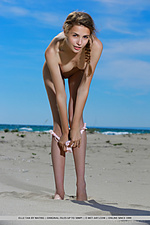 Elle tan elle tan bares her petite body as she strips at the beach.