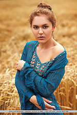 Jenya a jenya a strips in the field as she bares her slender body and meaty pussy.