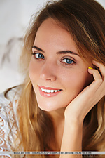 Mango a mango a sprawls naked in couch, showcasing her perfectly tanned body