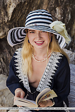 Taylor taylor displays her creamy body as she poses by the beach.