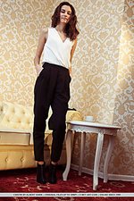 Cristin cristin flaunts her skinny body as she strips on the sofa.