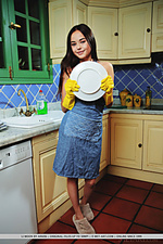 Li moon li moon bares her sexy body in her apron as she wash the dishes.