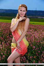 Kendell kendell poses among the flowers baring her creamy, slender body.