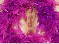 Wearing girly ponytail, nail polish, and a purple feathery boa, adele showcases her breathtaking, smooth body, luscious boobs and scrumptious pussy on an elegant white bed.