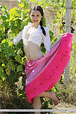 Ilona b in her gypsy attire, playfully lifting the hem of her pink skirt