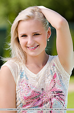 Claudie a sweet, smiling face as she undresses by the pool