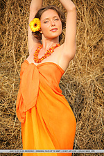 Janet a poses her tight body in an orange cover-up