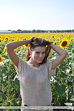 18-year-old valeria flaunts her youthful beauty and fresh assets amidst a sunflower field.