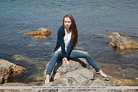 Milena looks delicately sweet and sexy, wearing a silver cardigan and her angelic, youthful appeal as she plays and have fun at the rocky beach.