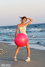 Posing on a sandy shore